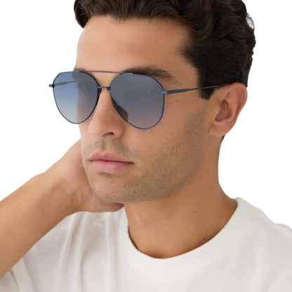 on model - male wearing diff eyewear featuring the dash aviator sunglasses with a deep navy metal frame and aegean blue flash lenses angled view