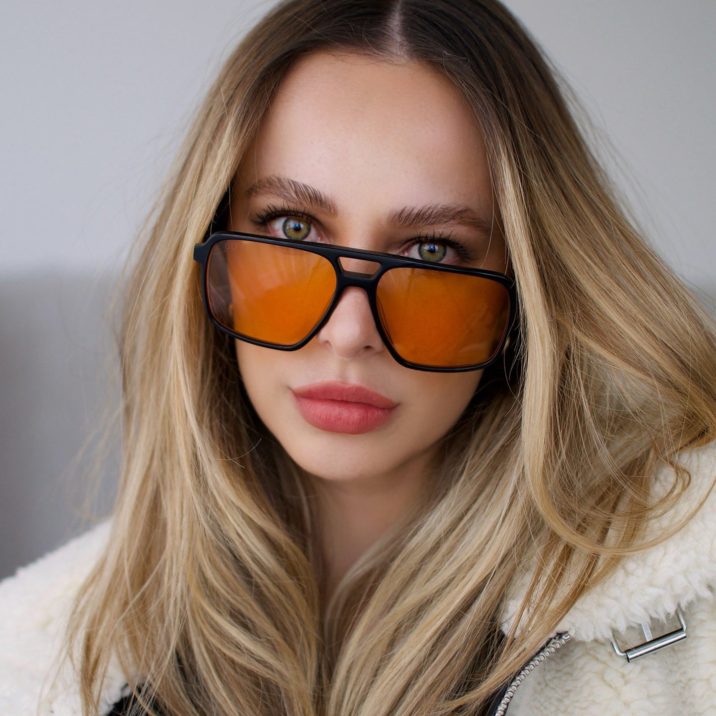 customer content - larissa.montana wearing star wars x diff eyewear fennec shand aviator sunglasses with a black frame and orange lenses front view