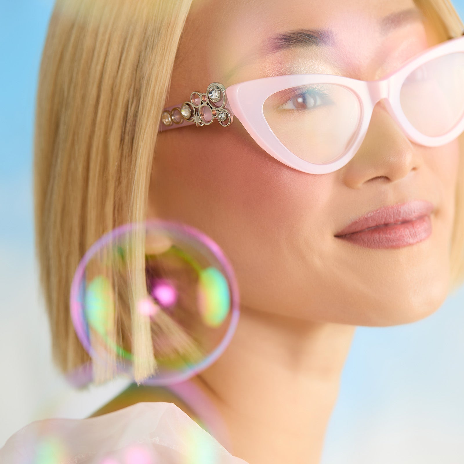on model - female wearing wicked x diff eyewear featuring the glinda upland for good cat eye prescription glasses with a pink frame front view