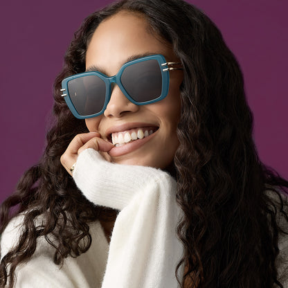 on model - female wearing diff eyewear featuring the dasha square sunglasses with a dark teal acetate frame and grey lenses front view