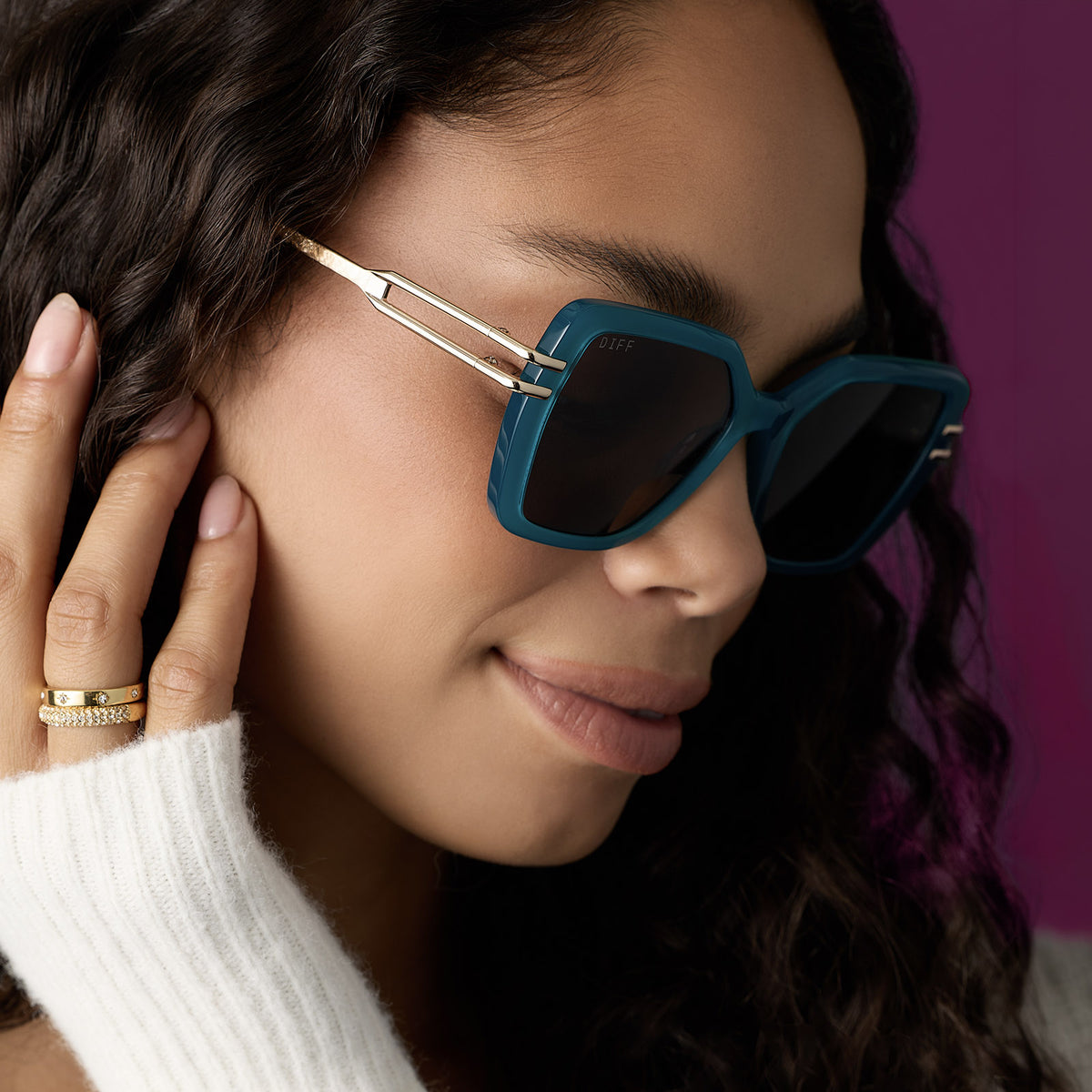 on model - female wearing diff eyewear featuring the dasha square sunglasses with a dark teal acetate frame and grey lenses angled view