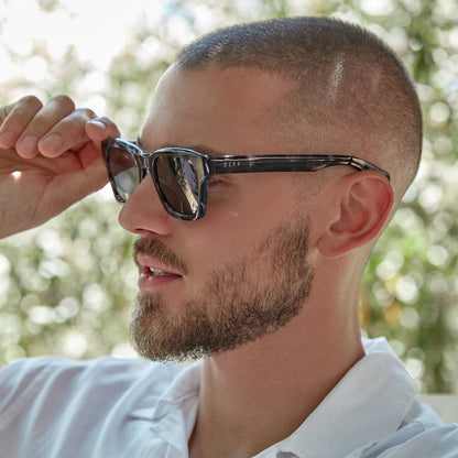 Man outside wearing the dean black marble and grey polarized