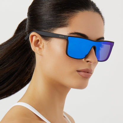 on model - female wearing on model - female wearing diff sport flash square sunglasses with a matte black frame and blue mirror polarized lenses side view