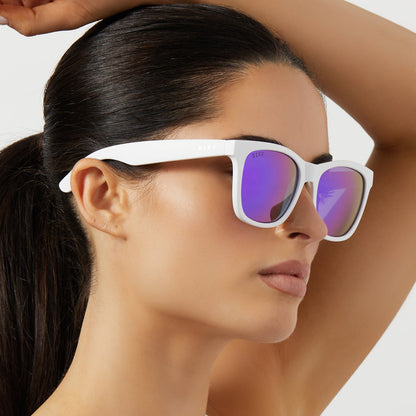 on model - female wearing diff sport sky square sunglasses with a matte white frame and sunset mirror polarized lenses side view