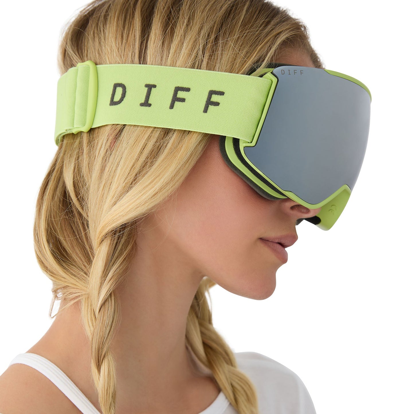 on model - female wearing diff sport alpine goggles in lime green with silver mirror polarized lens side view