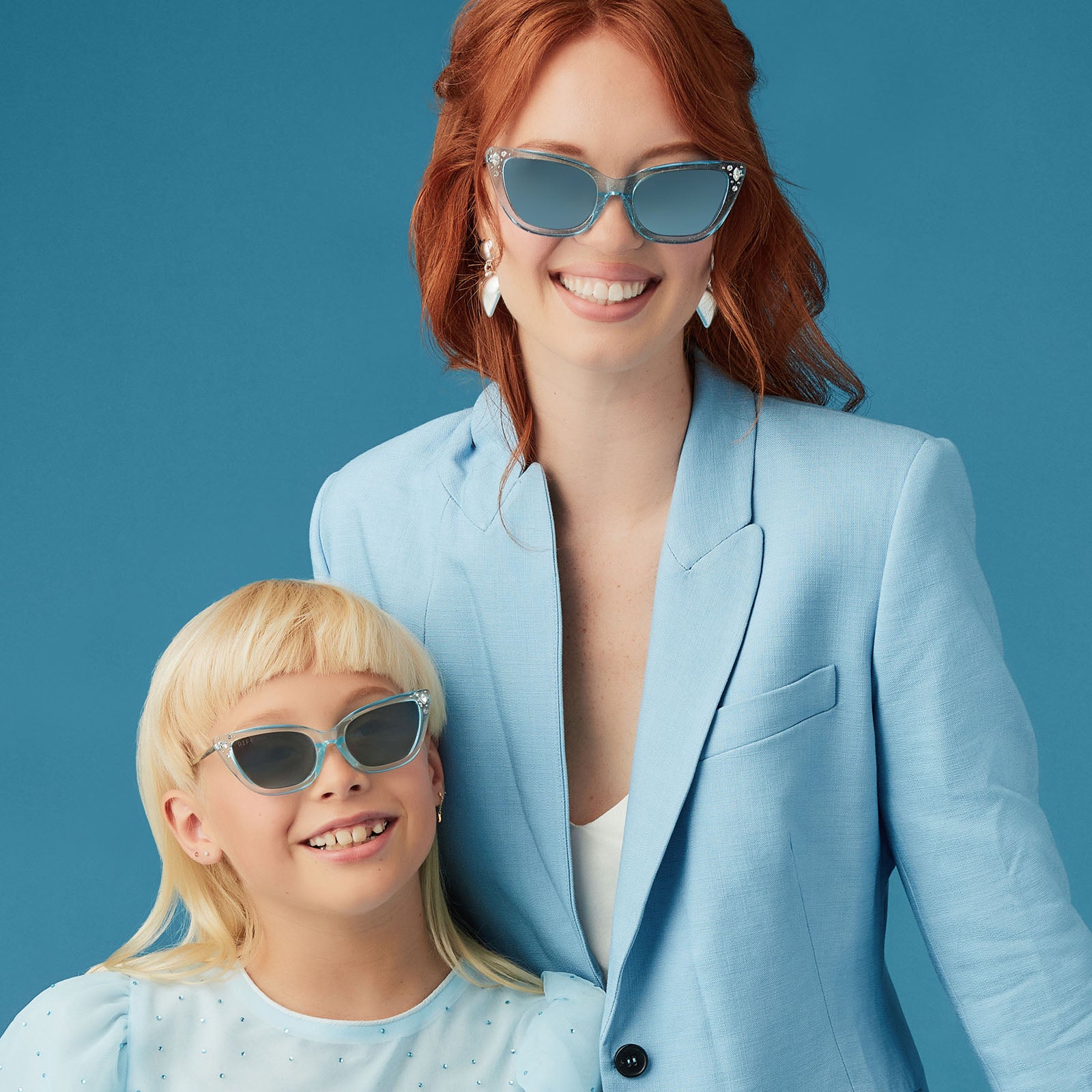 on model - mother wearing disney princess x diff eyewear cinderella sunglasses with matching youth pair on daughter 