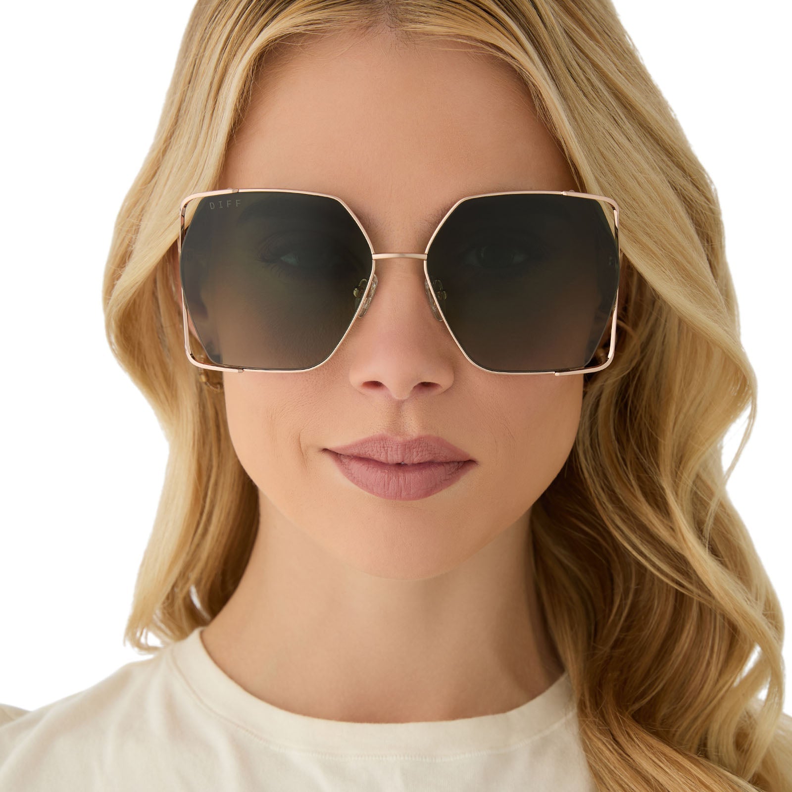on model - female wearing diff eyewear featuring the donna iv square sunglasses with a brushed champagne frame and cool matcha gradient polarized lenses front view
