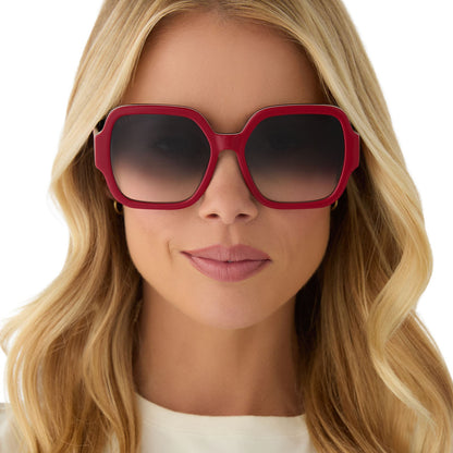 on model - female wearing clueless x diff eyewear featuring the dionne square sunglasses with a red frame and grey gradient lenses front view