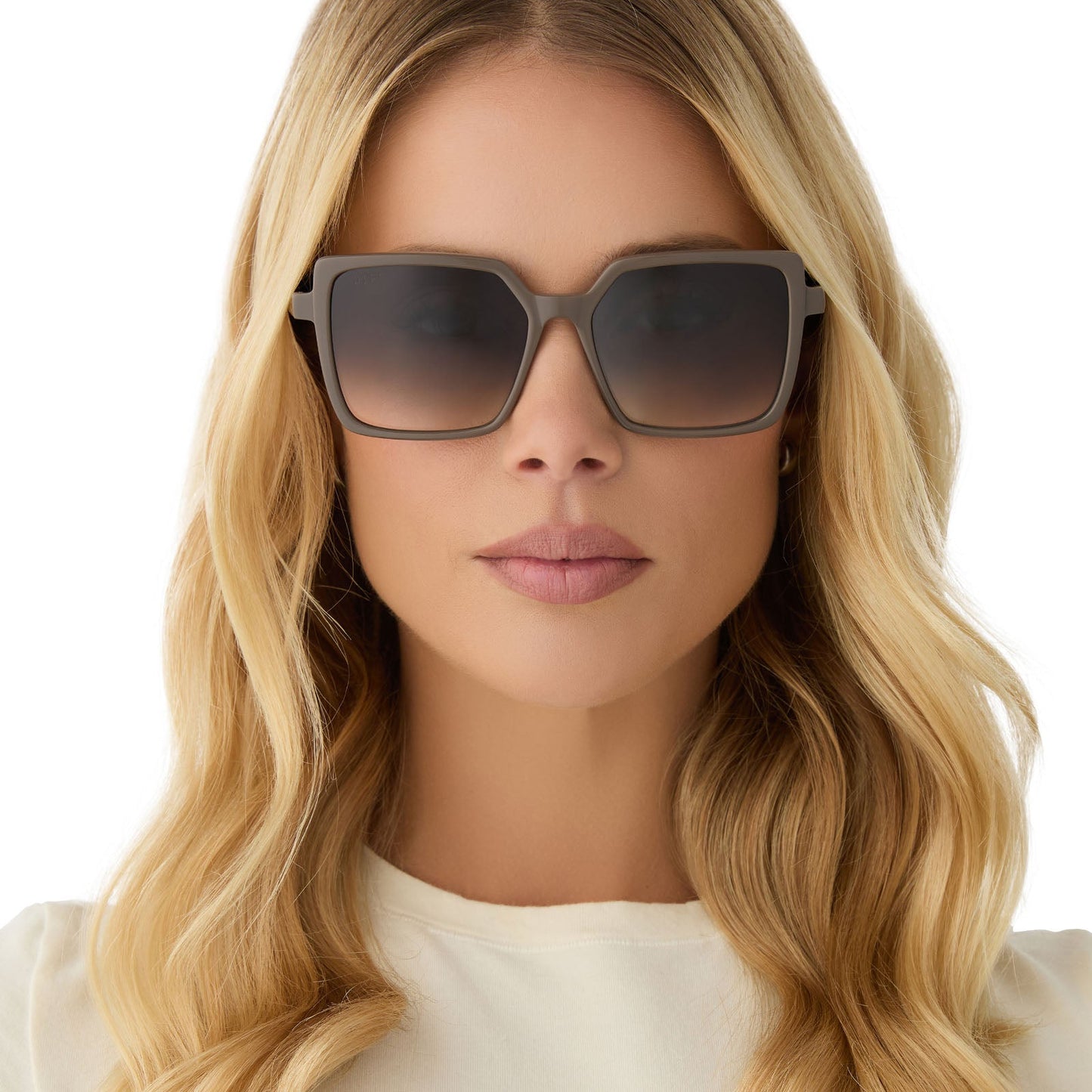 on model - female wearing diff eyewear featuring the esme square sunglasses with a london stone frame and grey gradient lenses front viewdiff eyewear featuring the esme square sunglasses with a london stone frame and grey gradient lenses front view