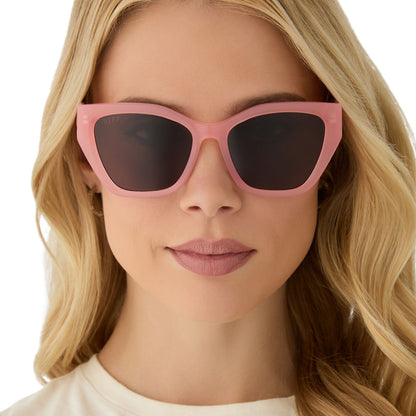 on model - female wearing diff eyewear featuring the evie cat eye sunglasses with a peach frame and brown polarized lenses front view