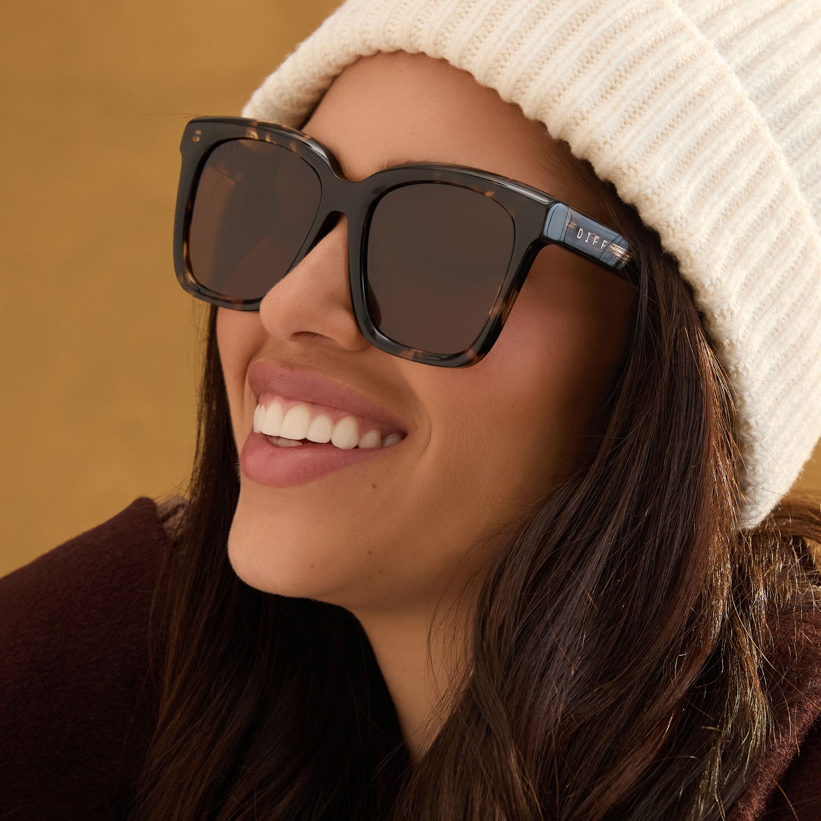 lifestyle - female wearing diff eyewear meredith square sunglasses with a espresso tortoise acetate frame and brown polarized lenses angled view