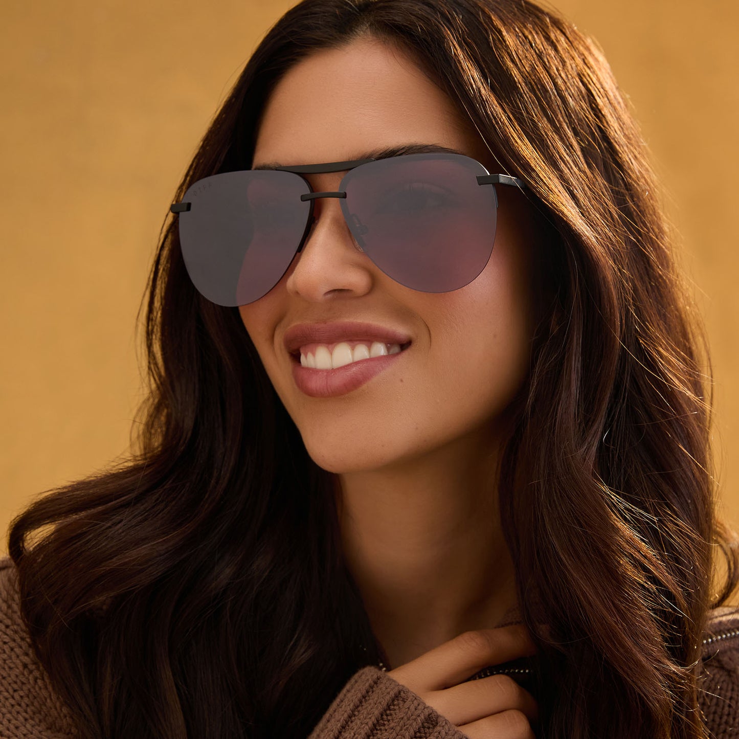 lifestyle - female wearing diff eyewear tahoe aviator sunglasses black & aubergine silver flash front view