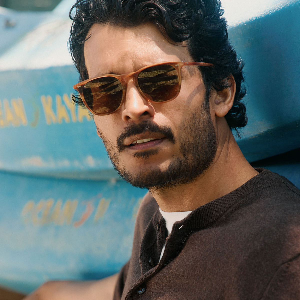 lifestyle - male wearing diff eyewear featuring the maxwell xl square sunglasses with a longhorn brown frame and brown polarized lenses front view