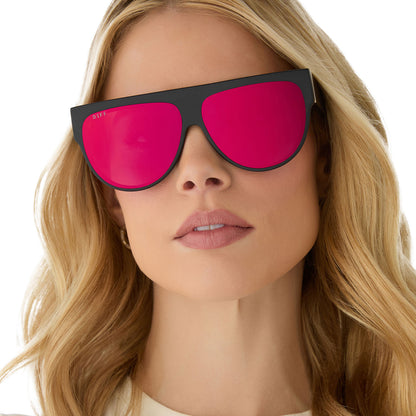 on model - female wearing diff eyewear georgie square sunglasses with a matte black frame and red hot summer mirror front view