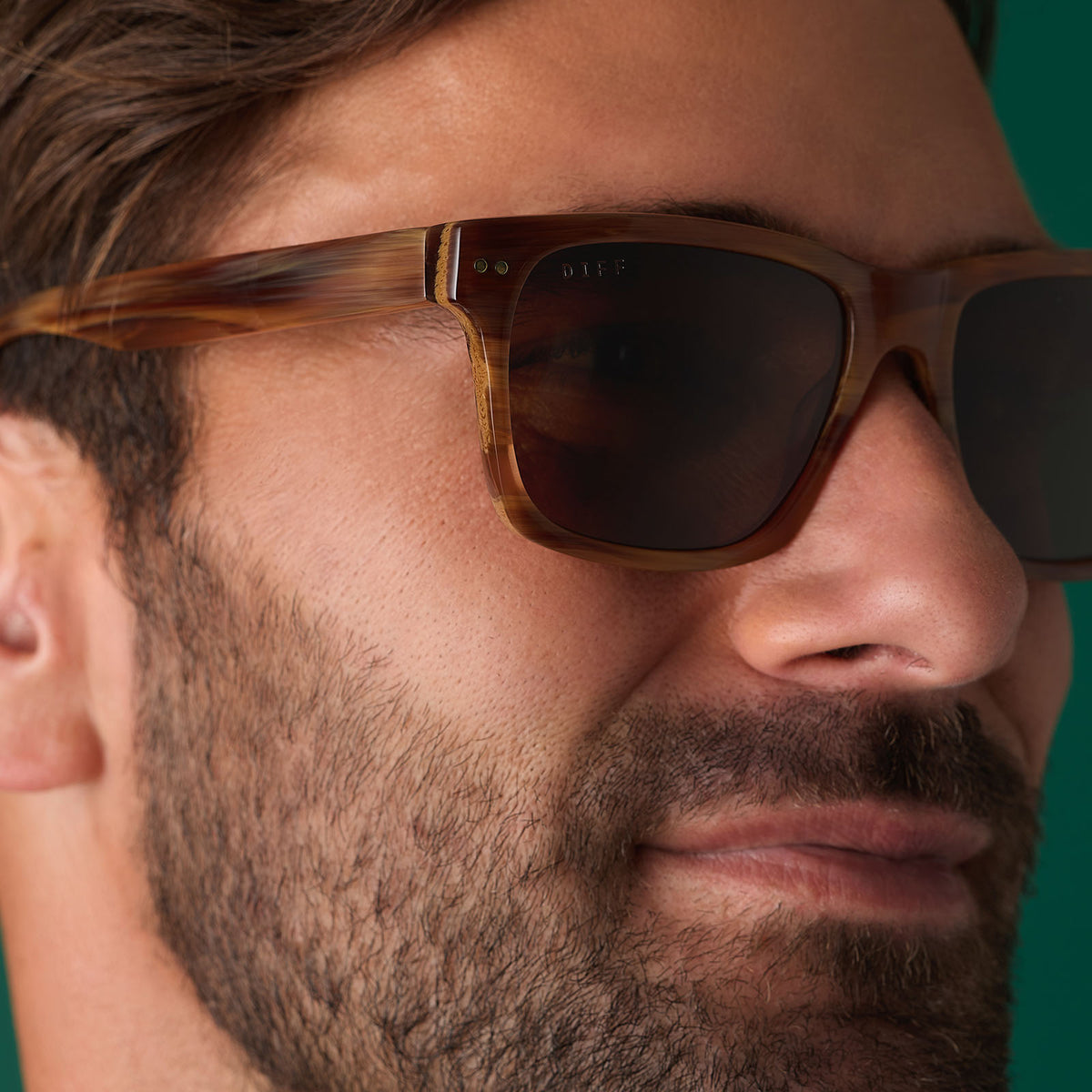 on model - male wearing diff eyewear featuring the gino xl square sunglasses with a longhorn brown frame and brown polarized lenses angled view