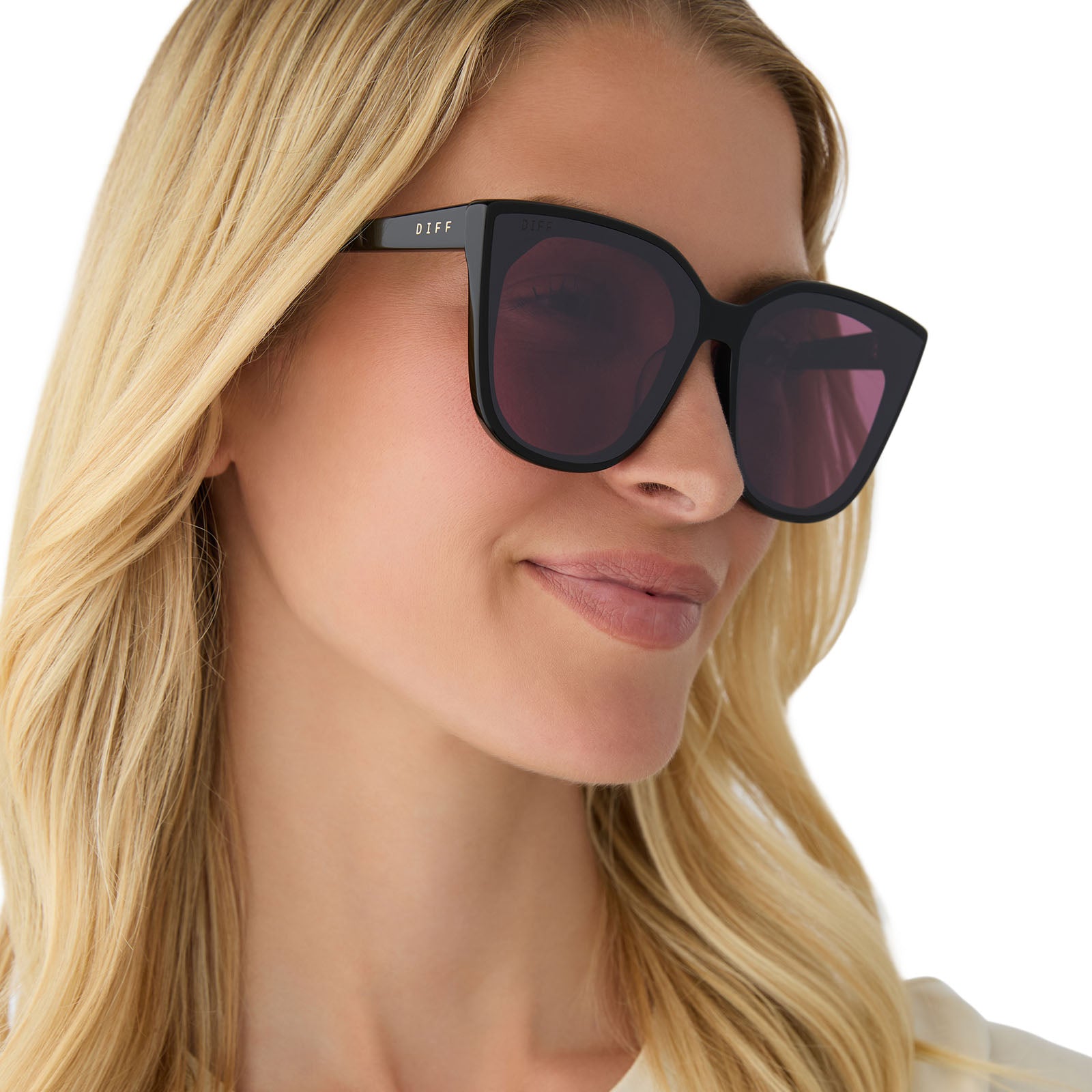 on model - female wearing diff eyewear featuring the gjelina cat eye sunglasses with a black frame and aubergine with silver flash lenses angled view