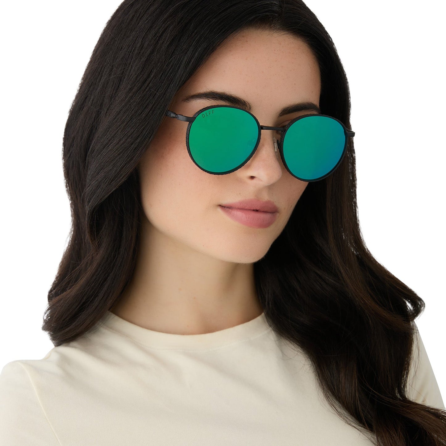 on model - female wearing harry potter x diff eyewear featuring the snape round sunglasses with a matte black metal frame and green mirror lenses angled view