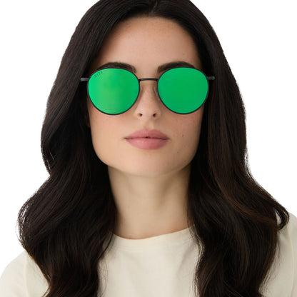 on model - female wearing harry potter x diff eyewear featuring the snape round sunglasses with a matte black metal frame and green mirror lenses front view