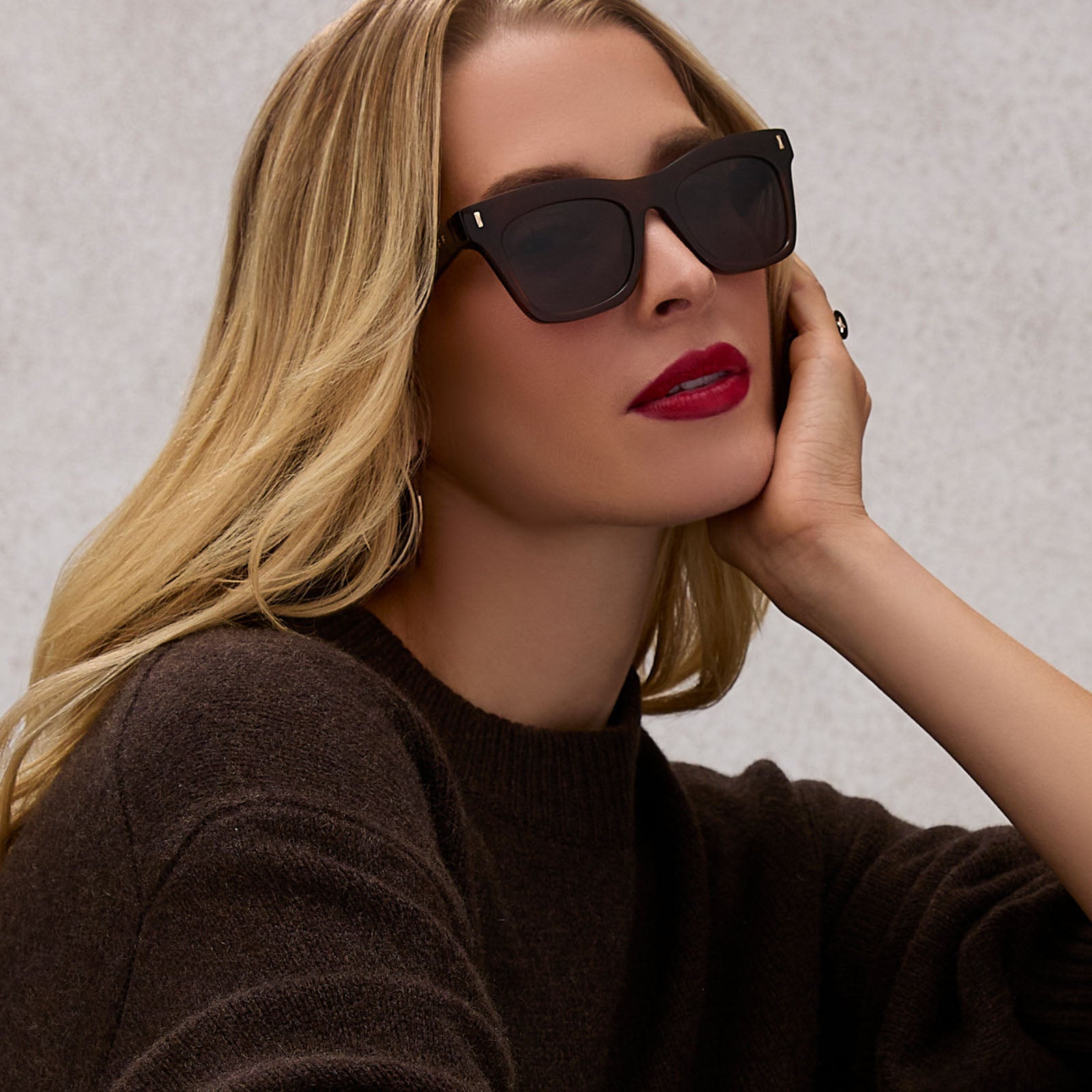 on model - female wearing diff eyewear featuring the bradley cat eye sunglasses with a whiskey brown frame and grey lenses front view