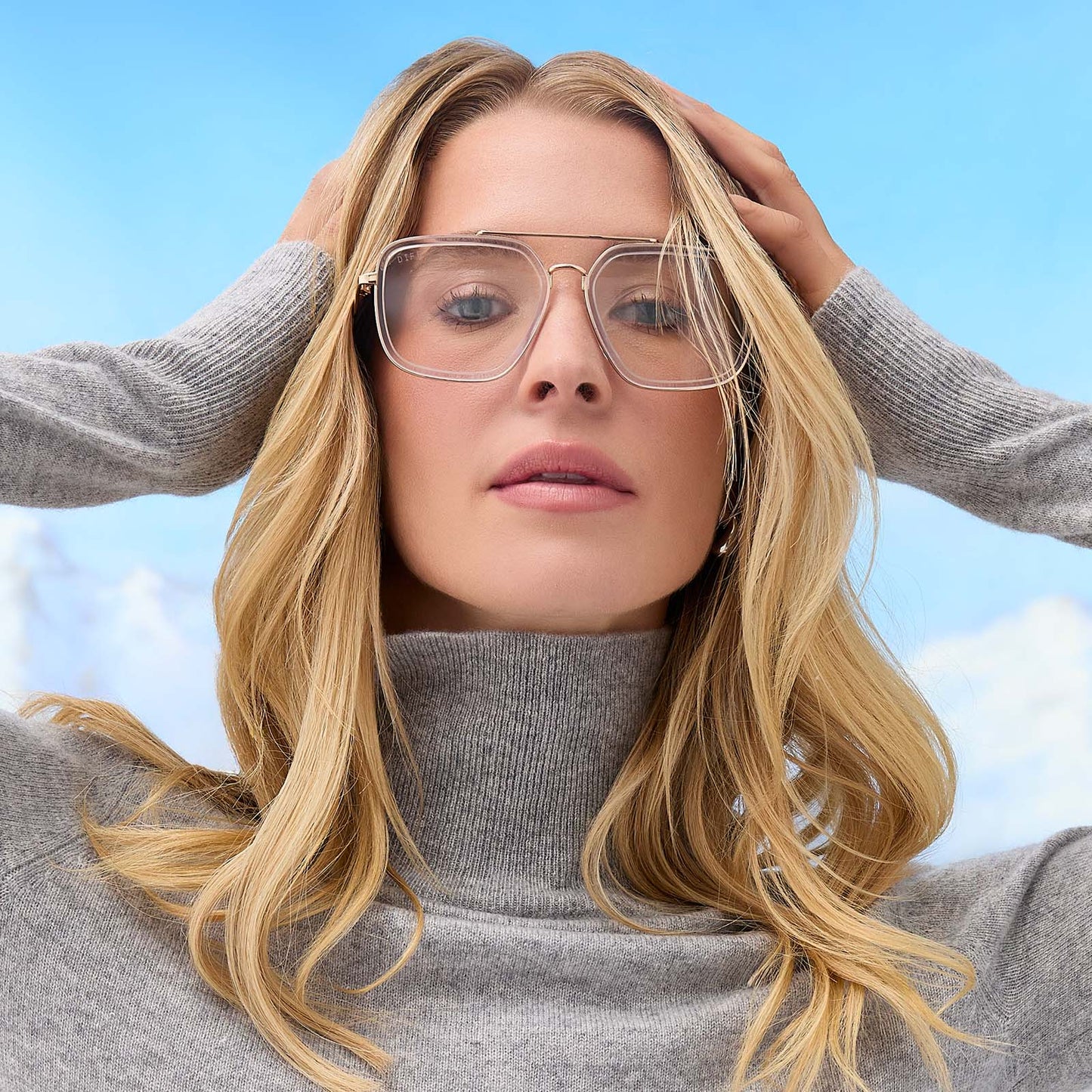 on model - female wearing diff eyewear featuring the jordan navigator prescription glasses with a gold frame, clear crystal temple tips front view