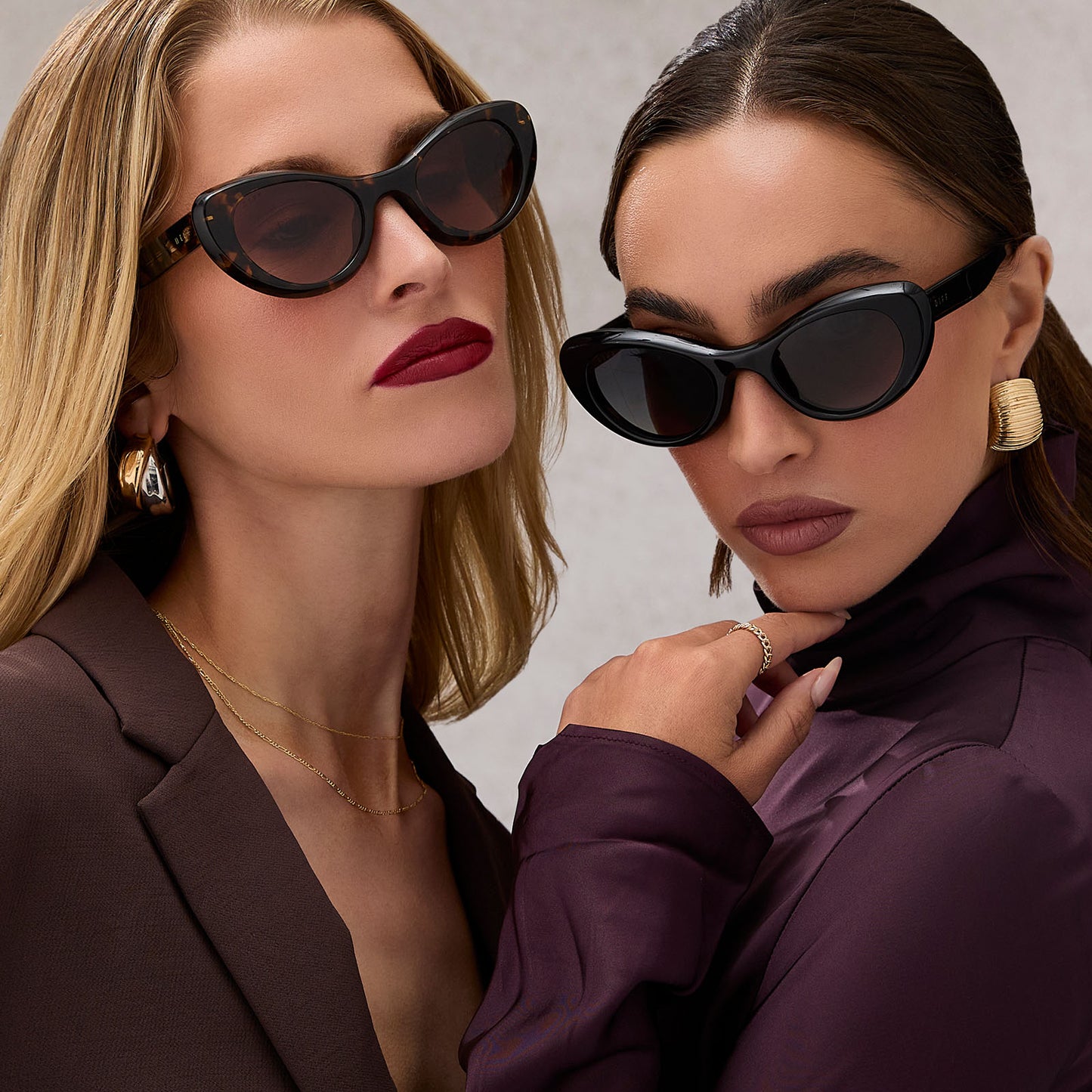 group shot of two females wearing diff eyewear zaria espresso tortoise and zaria black sunglasses