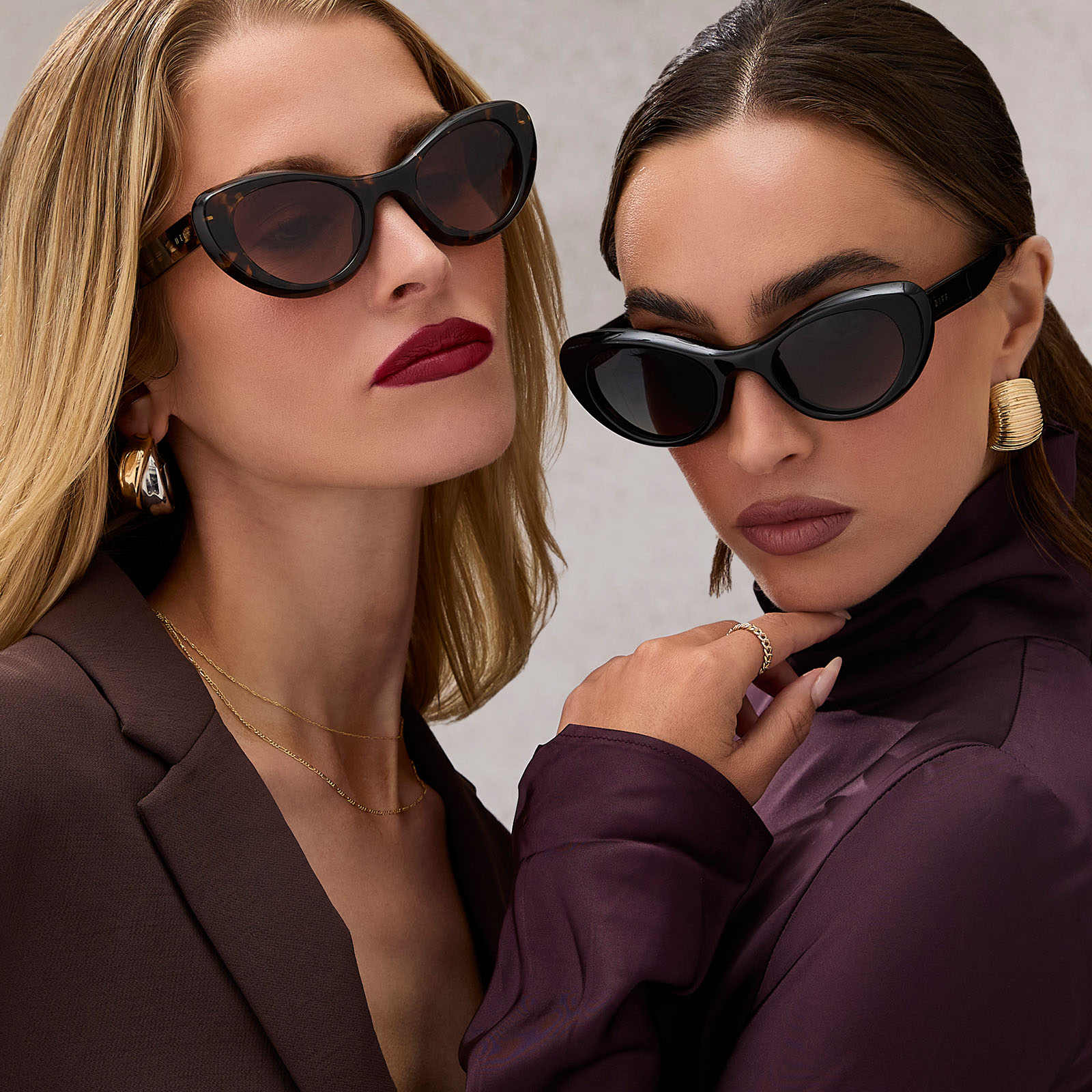 group shot of two females wearing diff eyewear zaria espresso tortoise and zaria black sunglasses