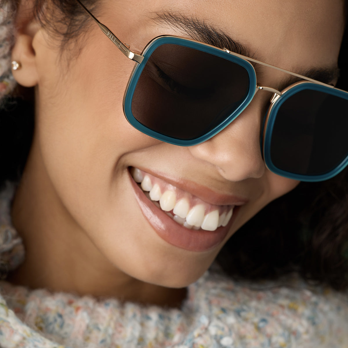 on model - female wearing diff eyewear featuring the jordan navigator sunglasses with a dark teal frame and grey polarized lenses angled view