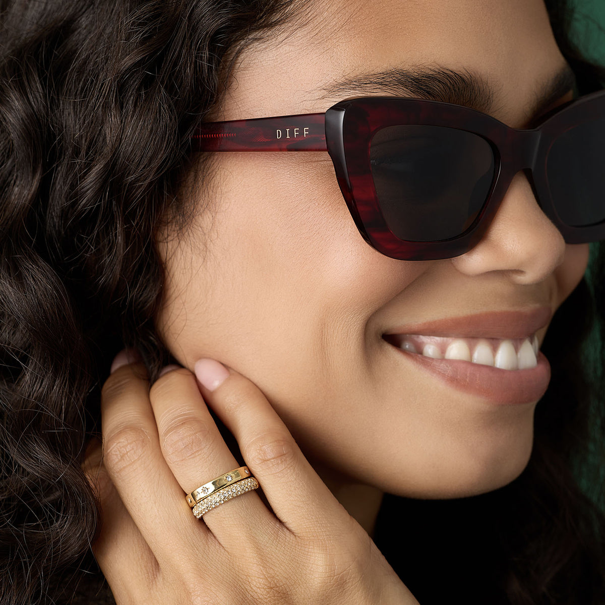 on model - female wearing diff eyewear featuring the adriana cateye sunglasses with a rich red tortoise frame and grey lenses detailed view