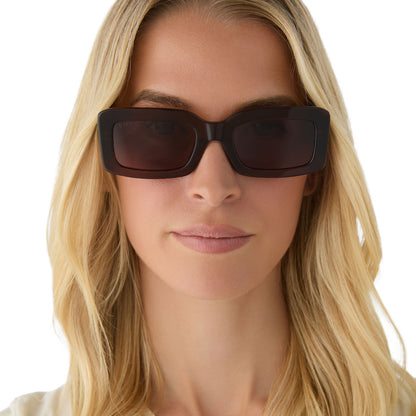 on model - female wearing diff eyewear featuring the indy rectangle sunglasses with a whiskey frame and brown polarized lenses front view