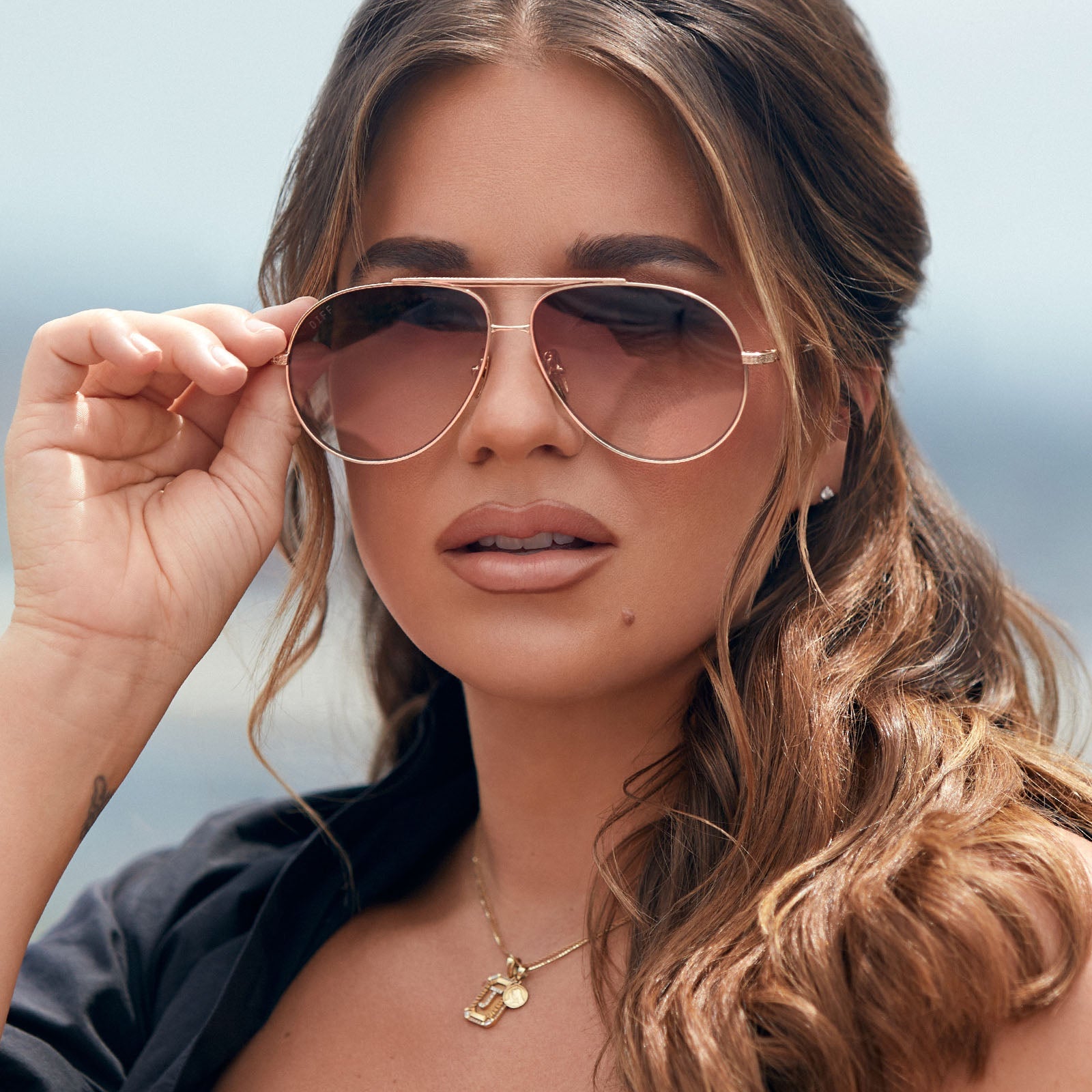 on model - female jessie james decker wearing the denver aviator sunglasses with a gold frame and brown gradient lenses front view