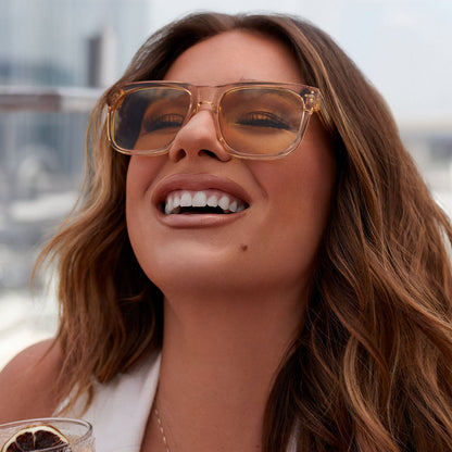 on model - female jessie james decker  wearing diff eyewear featuring the sicily square sunglasses with a honey crystal frame and honey bee lenses front view