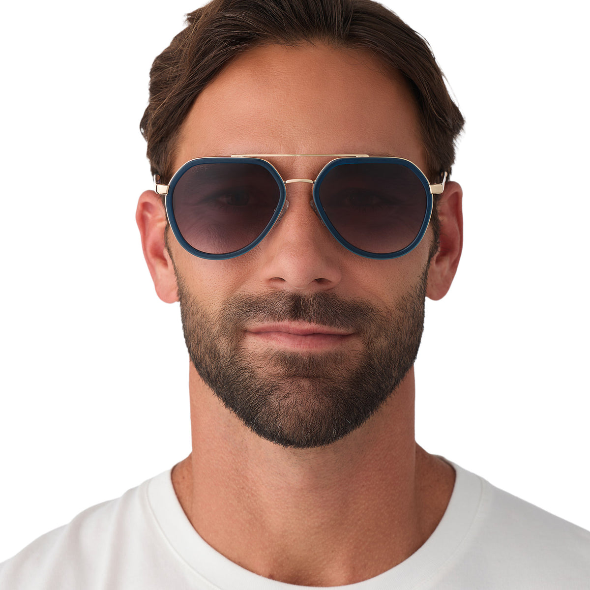 on model - male wearing diff eyewear featuring the joey round sunglasses with a clubhouse blue & brushed gold metal frame with grey gradient lenses front view