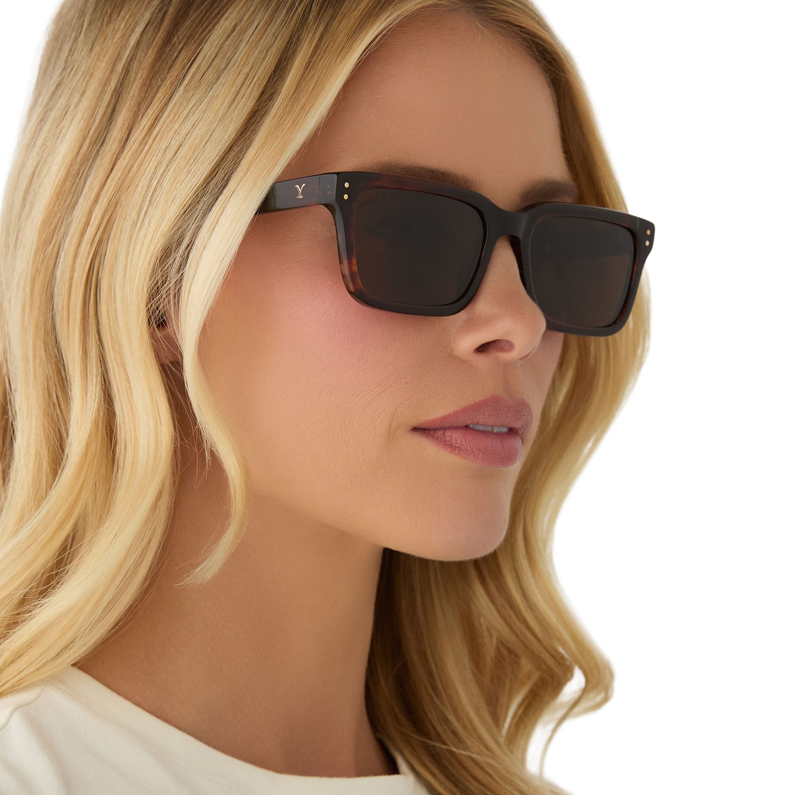 on model - female wearing yellowstone x diff eyewear featuring the john dutton rectangle sunglasses with a sequoia tortoise frame and brown polarized lenses angled view