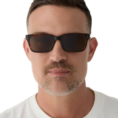 on model - male wearing yellowstone x diff eyewear featuring the john dutton rectangle sunglasses with a sequoia tortoise frame and brown polarized lenses front view