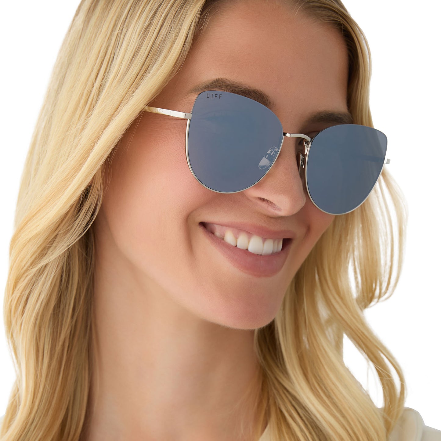 on model - female wearing diff eyewear featuring the kinsley round sunglasses with a silver frame and silver mirror polarized lenses angled view