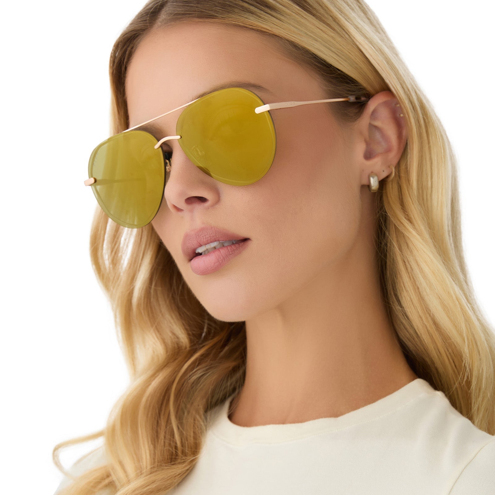 on model - female wearing diff eyewear featuring the lenox aviator sunglasses with a brushed gold frame and moss mirror polarized lenses angled view