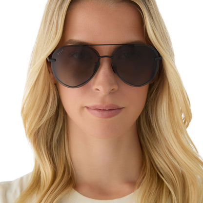 on model - female wearing diff eyewear featuring the lenox aviator sunglasses with a black + black temple tips frame and brown gradient polarized lenses front view