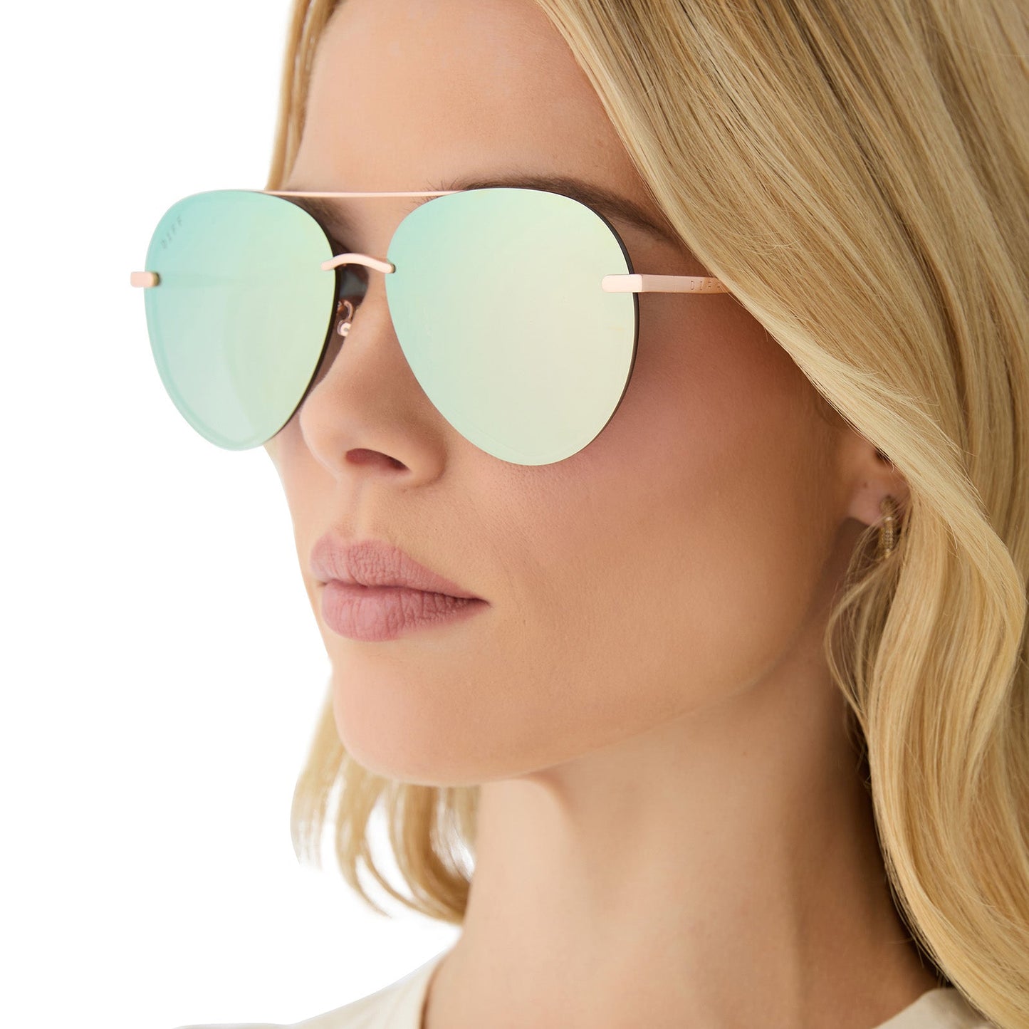 on model - female wearing diff eyewear featuring the lenox aviator sunglasses with a brushed champagne frame and cool matcha green mirror polarized lenses side view