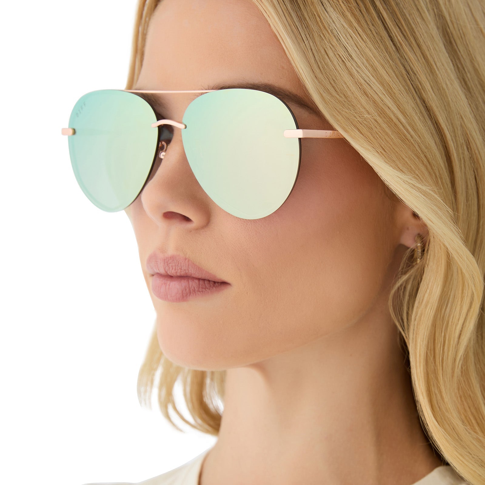 on model - female wearing diff eyewear featuring the lenox aviator sunglasses with a brushed champagne frame and cool matcha green mirror polarized lenses side view