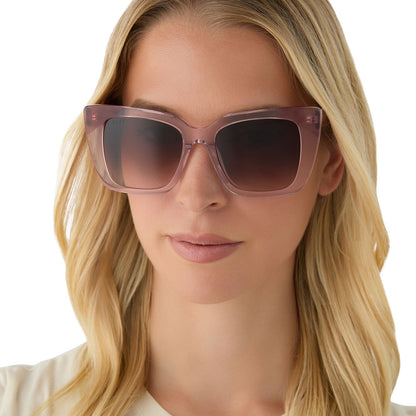 on model - female wearing diff eyewear featuring the lizzy cat eye sunglasses with a light pink crystal + fleur pink tort tips frame and brown gradient lenses front view