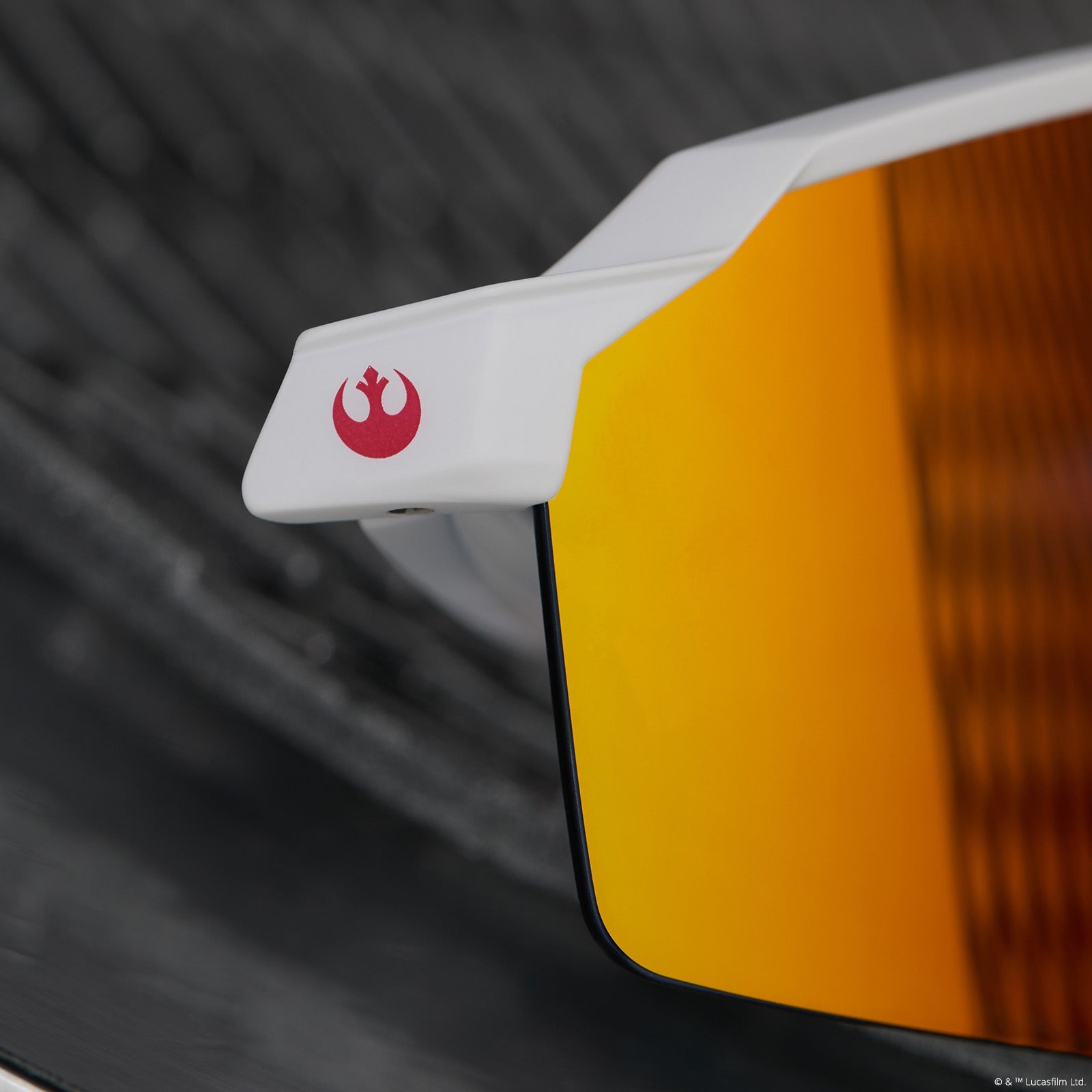 lifestyle - star wars™ x diff sport featuring the luke x-wing™ 2.0 shield sunglasses with a white frame and red orange fire mirror polarized lenses detailed view of hinge