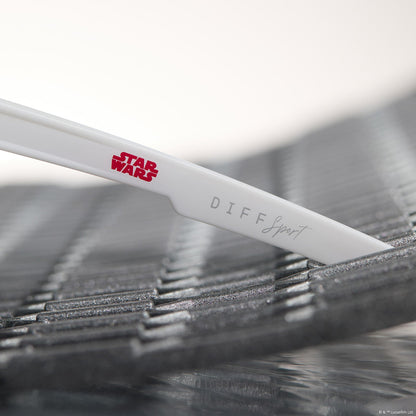 lifestyle - star wars™ x diff sport featuring the luke x-wing™ 2.0 shield sunglasses with a white frame and red orange fire mirror polarized lenses detailed view of temple leg
