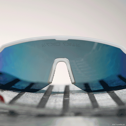 lifestyle - star wars™ x diff sport featuring the luke x-wing™ 2.0 shield sunglasses with a white frame and red orange fire mirror polarized lenses nose guard bridge animation