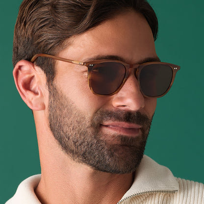 on model - male wearing diff eyewear featuring the maxwell xl square sunglasses with a longhorn brown frame and brown polarized lenses angled view