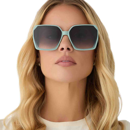 on model - female wearing diff eyewear featuring the presley square sunglasses with a steel teal frame and grey gradient lenses front view