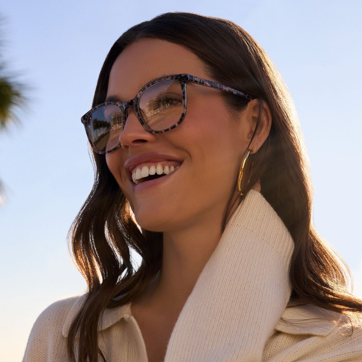 on model - female wearing diff eyewear featuring the parker square prescription glasses with a leopard tortoise frame angled view