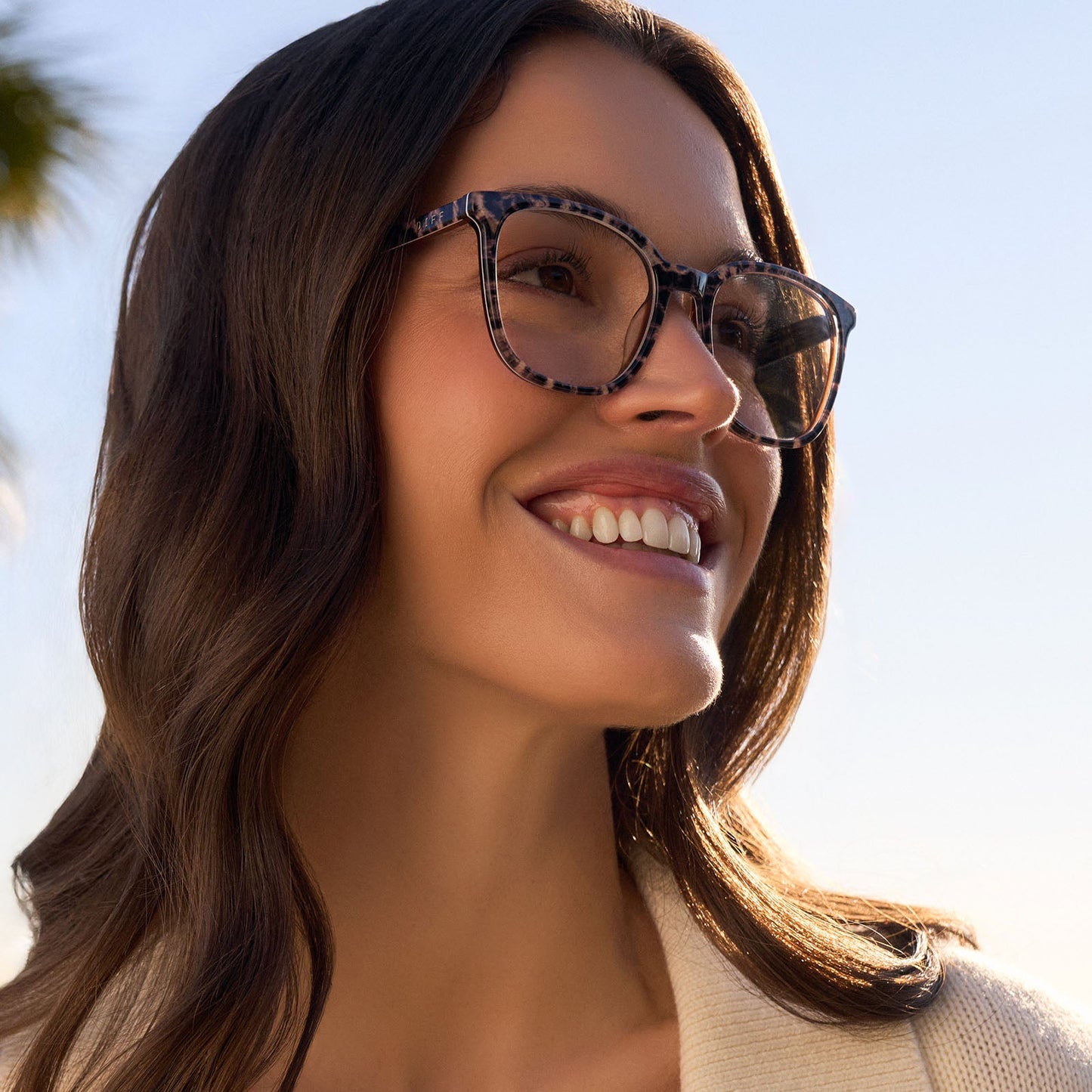 on model - female wearing diff eyewear featuring the parker square prescription glasses with a leopard tortoise frame angled view