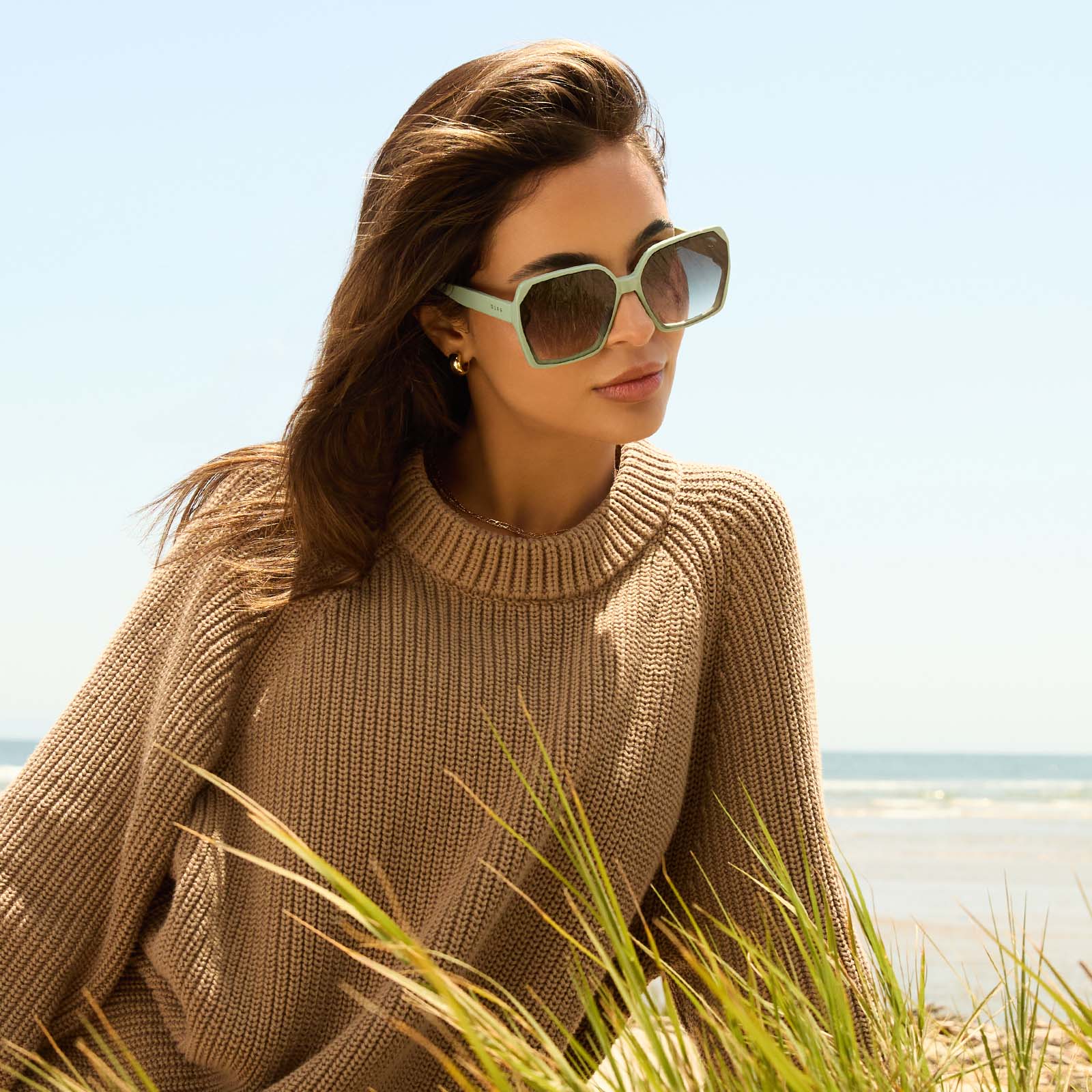 on model - female wearing diff eyewear featuring the presley square sunglasses with a steel teal frame and grey gradient lenses angled view