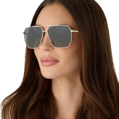 on model - female wearing diff eyewear featuring the berkely navigator sunglasses with a champagne gold (light gold) metal frame and aloe green gradient polarized lenses angled view