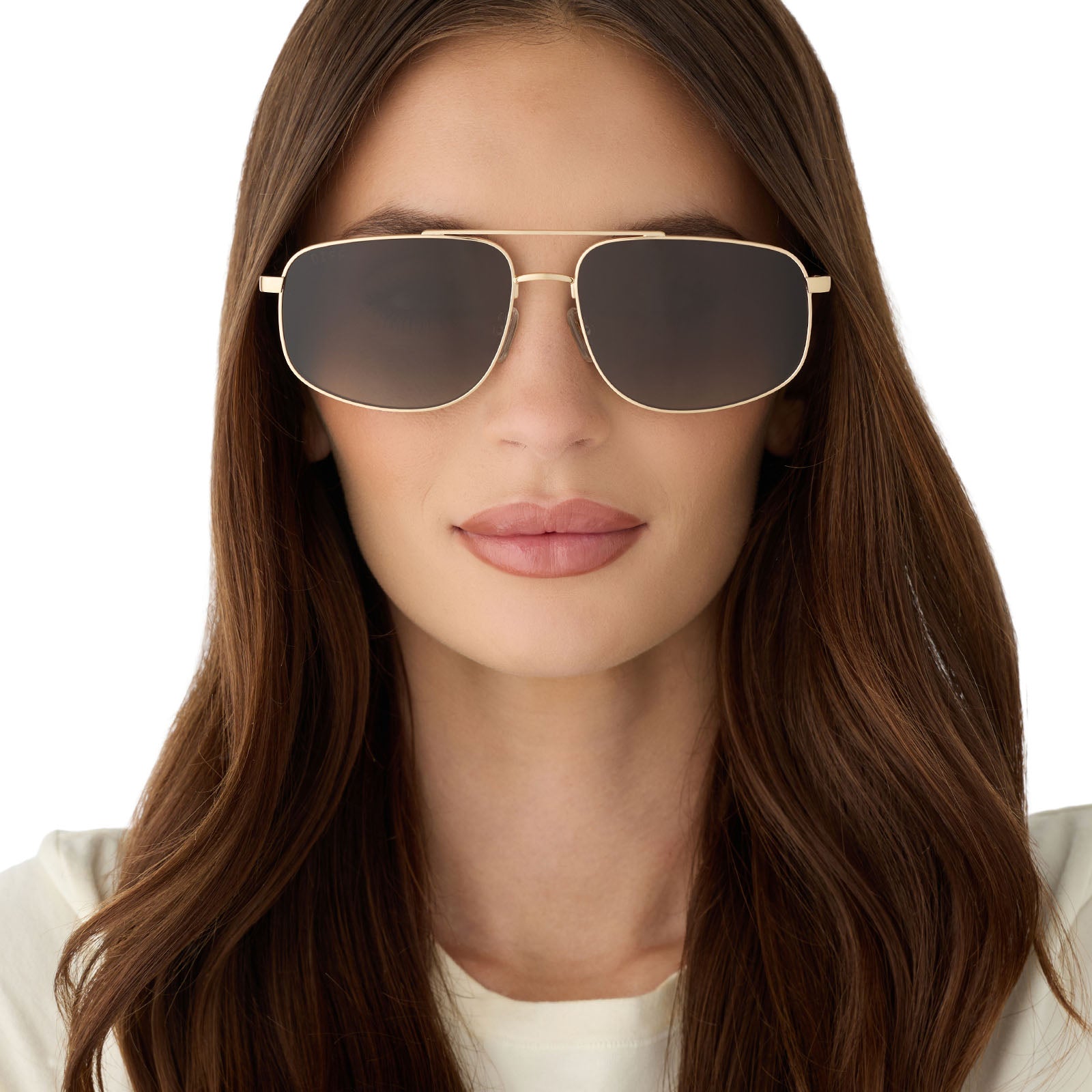 on model - female wearing diff eyewear featuring the charley navigator sunglasses with a brushed gold metal frame and aloe green gradient lenses front view